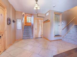 Step into this inviting entryway, showcasing a blend of rustic charm and modern design.