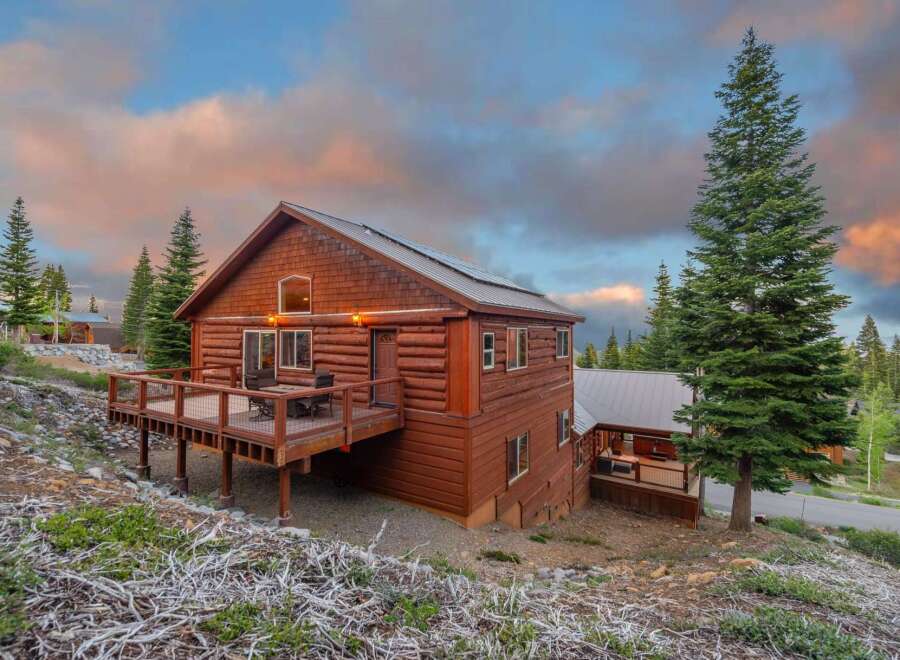 Nestled in a serene mountain setting, this stunning log cabin offers a perfect blend of rustic charm and modern comfort.