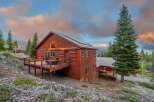 Nestled in a serene mountain setting, this stunning log cabin offers a perfect blend of rustic charm and modern comfort.