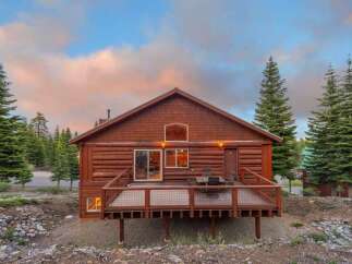 Nestled amidst the serene beauty of nature, this charming cabin offers a perfect blend of rustic elegance and modern comfort.