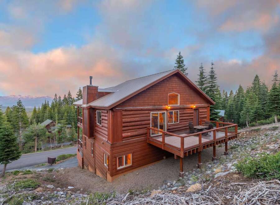 Nestled amidst a serene mountain landscape, this stunning cabin offers a perfect blend of rustic charm and modern comfort.
