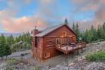 Nestled amidst a serene mountain landscape, this stunning cabin offers a perfect blend of rustic charm and modern comfort.