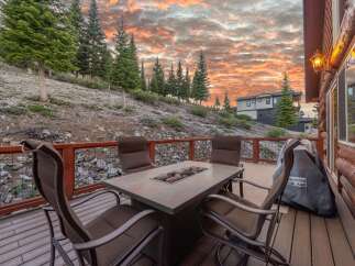 Enjoy breathtaking sunsets from this stunning outdoor deck, perfect for entertaining or relaxing.