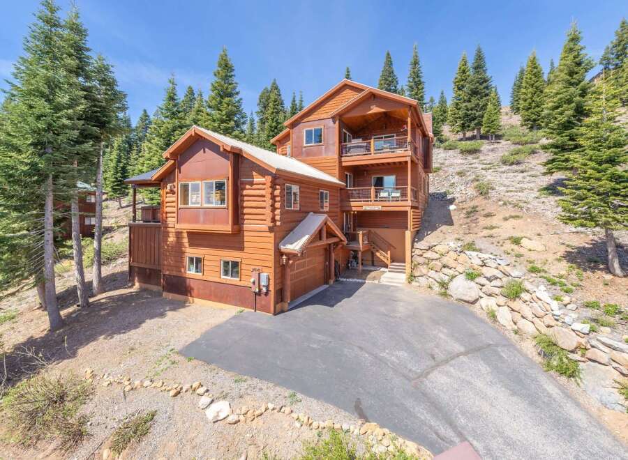 Nestled in a serene mountain setting, this stunning log cabin offers a perfect blend of rustic charm and modern comfort.