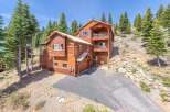 Nestled in a serene mountain setting, this stunning log cabin offers a perfect blend of rustic charm and modern comfort.