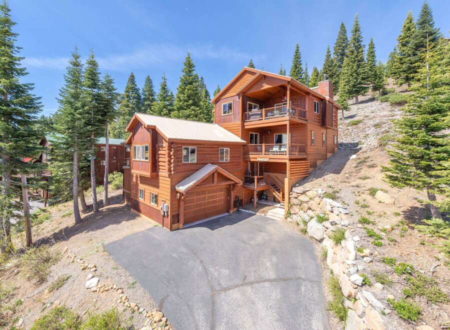 This stunning mountain home offers a luxurious retreat with its spacious design and breathtaking views.