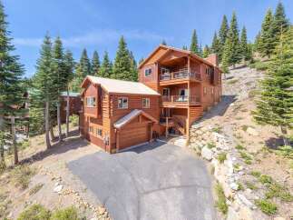 This stunning mountain home offers a luxurious retreat with its spacious design and breathtaking views.