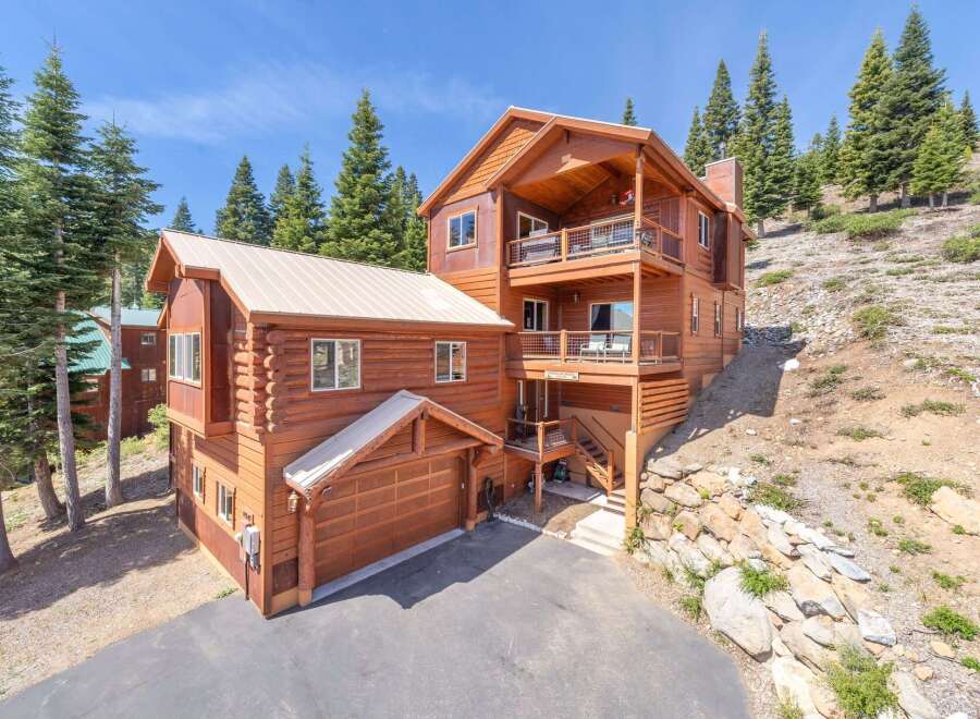This stunning mountain home offers a perfect blend of rustic charm and modern comfort.
