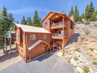 This stunning mountain home offers a perfect blend of rustic charm and modern comfort.