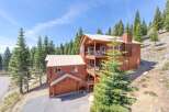 Nestled amidst towering pines, this stunning mountain home offers a serene escape.