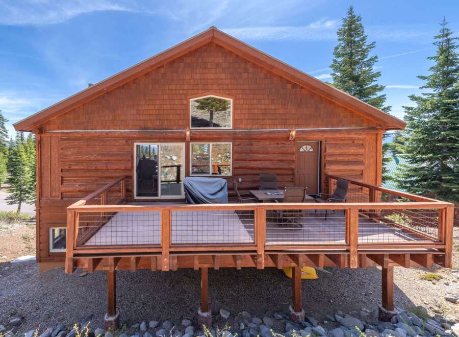 Discover the charm of this stunning cabin, boasting a spacious deck perfect for outdoor relaxation and entertaining.