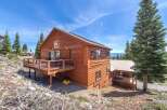 This stunning mountain cabin offers a perfect blend of rustic charm and modern comfort.