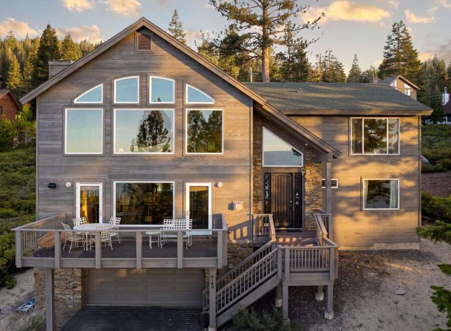 This stunning property boasts a modern design with expansive windows that flood the interior with natural light.