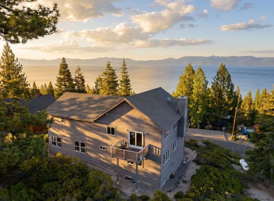 Experience breathtaking views from this stunning property! This home features a spacious deck, perfect for enjoying the serene surroundings.