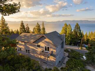 Experience breathtaking views from this stunning property! This home features a spacious deck, perfect for enjoying the serene surroundings.