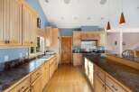 This stunning kitchen boasts a spacious layout, perfect for both cooking and entertaining.