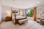 Experience luxury in this stunning bedroom featuring a four-poster bed and elegant furnishings.