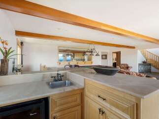 Discover luxury living at its finest with this stunning property, featuring a beautifully designed bar area.