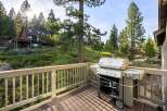 Enjoy outdoor living at its finest with this stunning property featuring a spacious deck and a high-quality Weber grill.