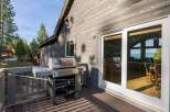 Enjoy outdoor living at its finest with this stunning property featuring a spacious deck and a high-end Weber grill, perfect for entertaining.