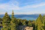 Enjoy breathtaking views from this stunning property! This home offers a serene escape with panoramic views of the lake and surrounding mountains.