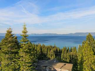 Enjoy breathtaking views from this stunning property! This home offers a serene escape with panoramic views of the lake and surrounding mountains.