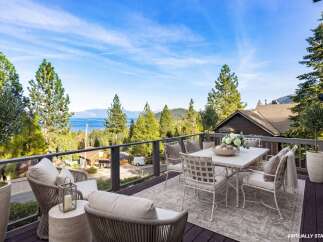 Enjoy breathtaking views from this stunning property! This home features a spacious deck perfect for outdoor dining and relaxation.