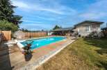 Enjoy the ultimate outdoor oasis with this stunning property! Featuring a sparkling swimming pool, perfect for those hot summer days, and a spacious backyard ideal for entertaining.