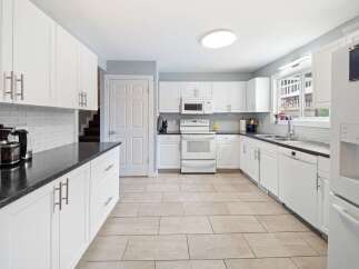 This stunning kitchen boasts a bright and airy atmosphere, perfect for culinary creations and entertaining.