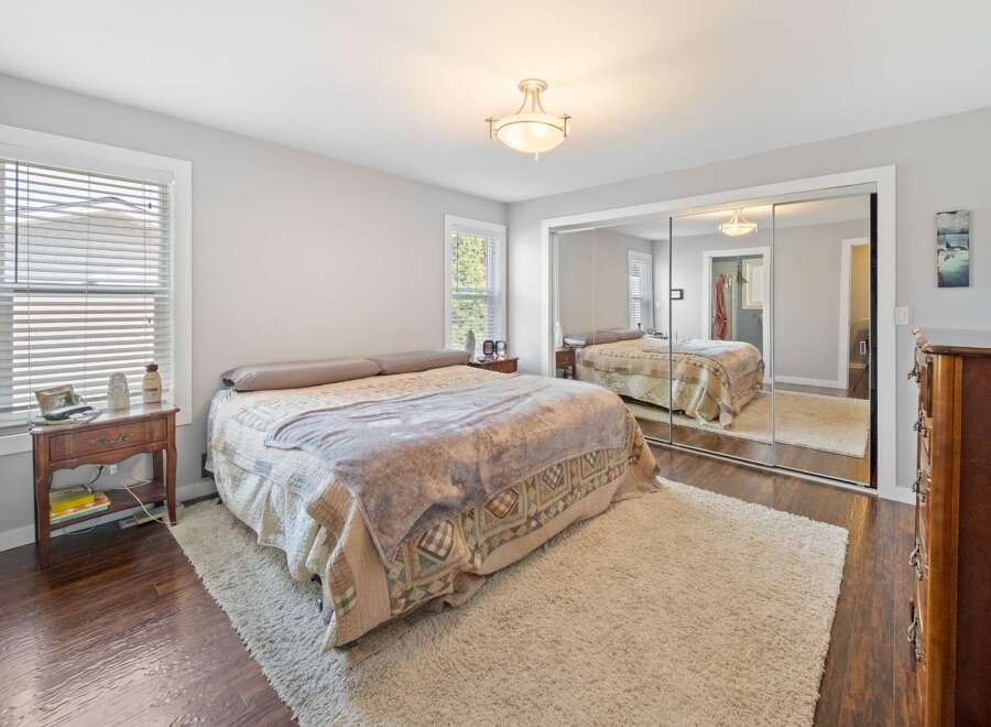Step into this inviting bedroom, featuring a cozy bed and a plush rug.
