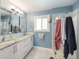 This stunning bathroom boasts a modern design with a touch of elegance.