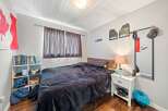 Cozy bedroom with a comfortable bed, perfect for relaxation.
