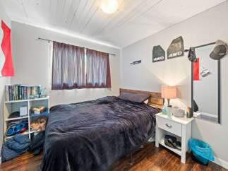 Cozy bedroom with a comfortable bed, perfect for relaxation.
