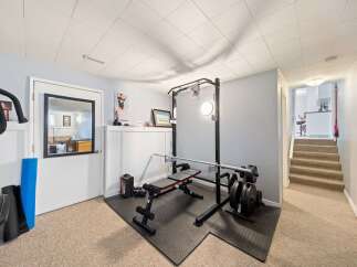 This home gym offers a dedicated space for fitness enthusiasts.
