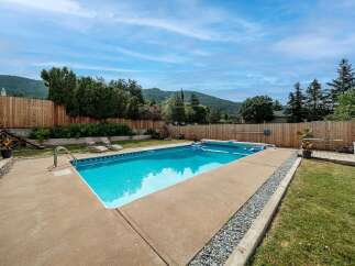 Enjoy the ultimate outdoor oasis with this stunning property featuring a sparkling swimming pool.