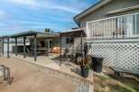 Enjoy outdoor living at its finest with this stunning property featuring a spacious patio and a relaxing hot tub.