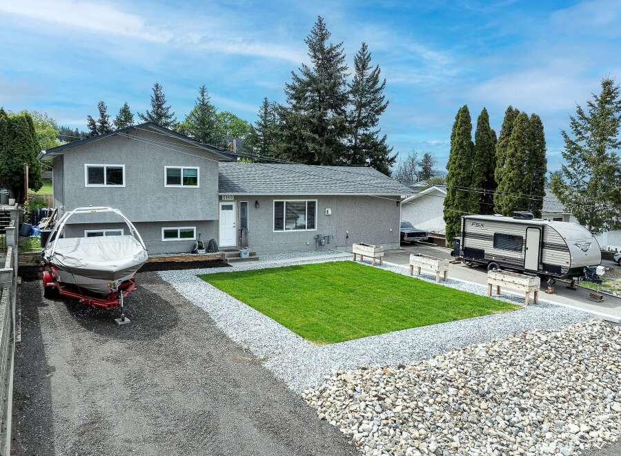 This charming property boasts a well-maintained exterior with a modern aesthetic.