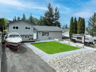 This charming property boasts a well-maintained exterior with a modern aesthetic.