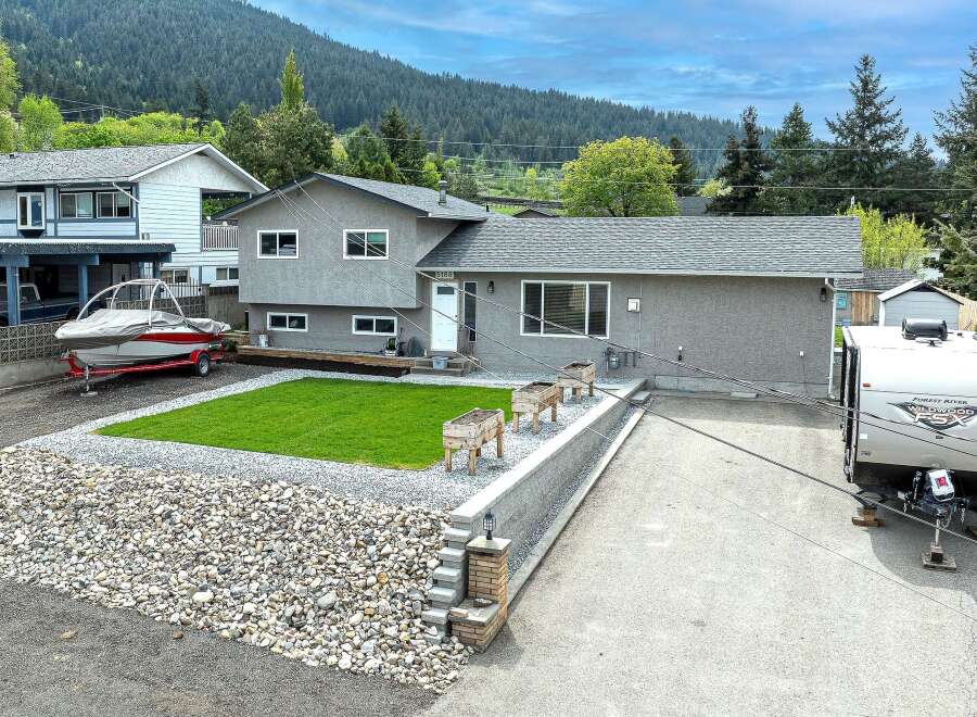 This charming property boasts a well-maintained exterior with a modern aesthetic.