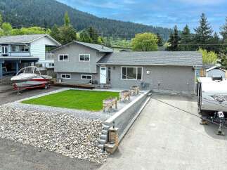 This charming property boasts a well-maintained exterior with a modern aesthetic.