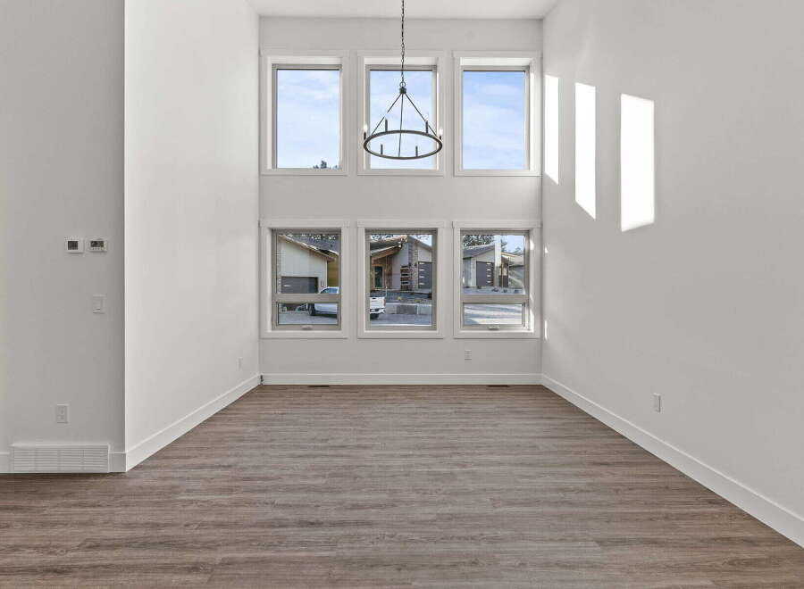 This stunning property boasts an open-concept living space with soaring ceilings and abundant natural light.