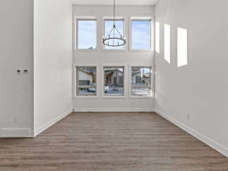 This stunning property boasts an open-concept living space with soaring ceilings and abundant natural light.