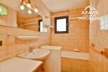 Discover this charming bathroom featuring a sink, a bathtub, and a window, perfect for your daily routines.