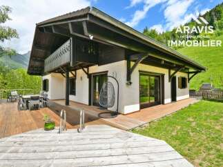 Discover your dream home in the heart of nature! This stunning property boasts a spacious wooden deck, perfect for outdoor entertaining and relaxation.