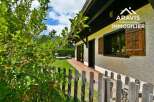 Discover this charming property featuring a beautifully designed exterior and inviting wooden accents.