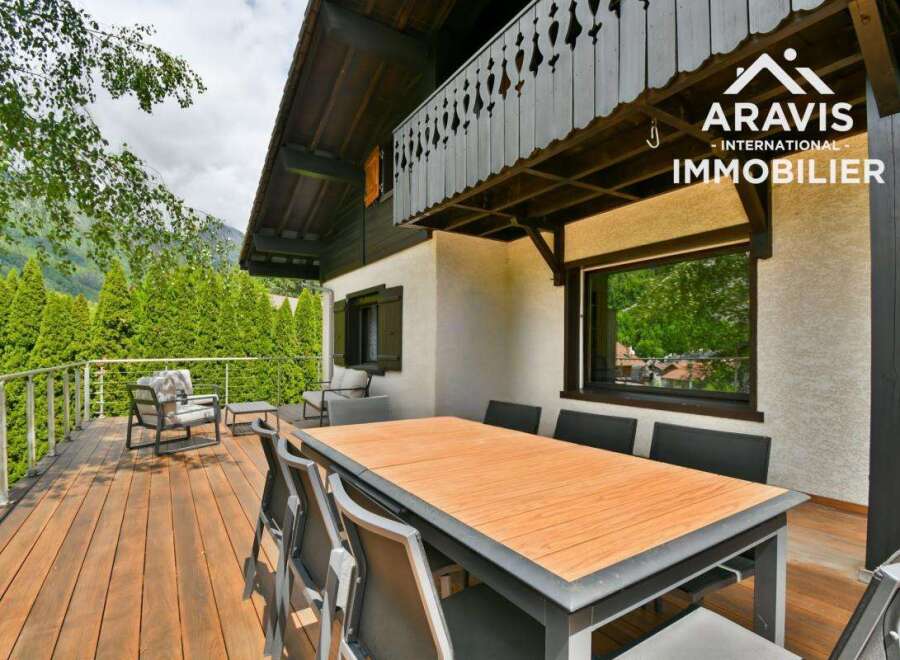 Enjoy breathtaking views from this stunning property featuring a spacious deck and a stylish dining area.