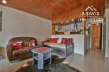 Discover this charming property featuring a cozy living area with a comfortable sofa and a stylish daybed, perfect for relaxation.