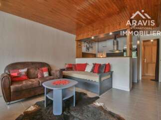Discover this charming property featuring a cozy living area with a comfortable sofa and a stylish daybed, perfect for relaxation.