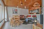 Discover this charming property featuring a cozy living space with a unique wooden ceiling and stylish decor.