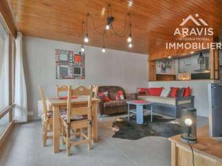 Discover this charming property featuring a cozy living space with a unique wooden ceiling and stylish decor.